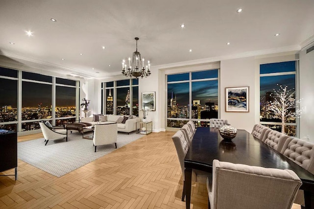 dining space with light parquet flooring, a notable chandelier, and crown molding