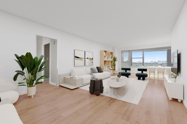 1020 Grand Concourse Unit 20C, New York City, NY 10452 - living room featuring baseboards and light wood-style floors
