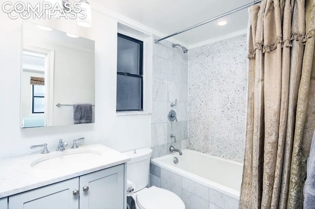 full bathroom with vanity, crown molding, shower / bath combination with curtain, and toilet