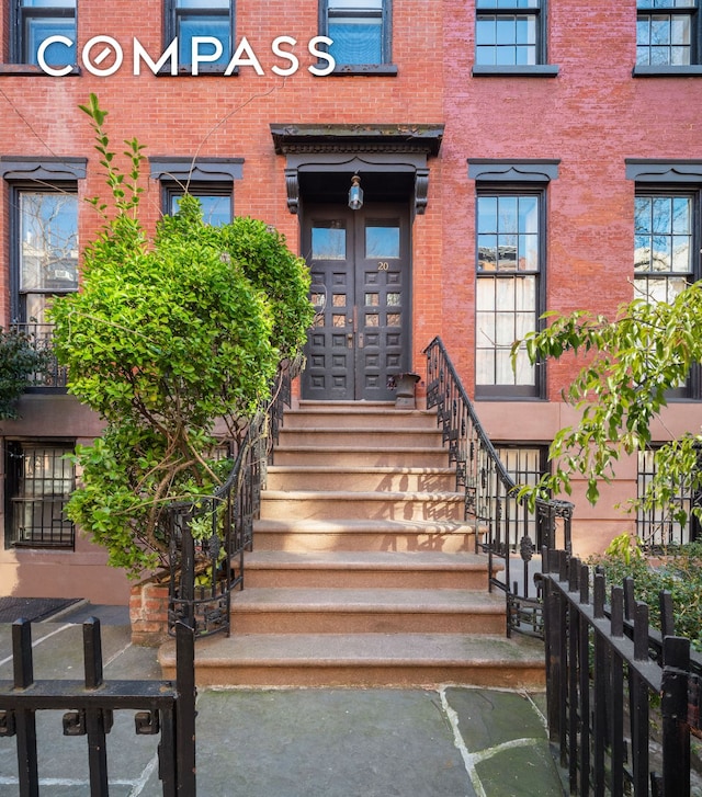 entrance to property with brick siding