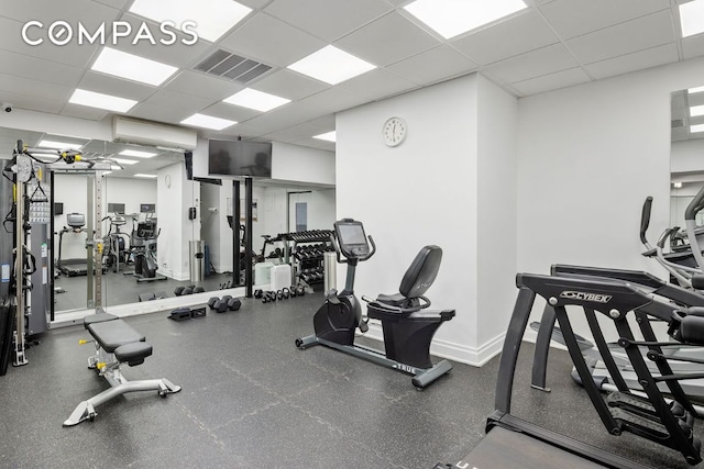 workout area featuring a drop ceiling