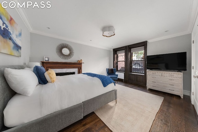 bedroom featuring dark wood-type flooring and crown molding