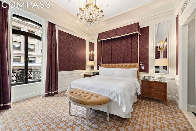 bedroom featuring ornamental molding and a chandelier