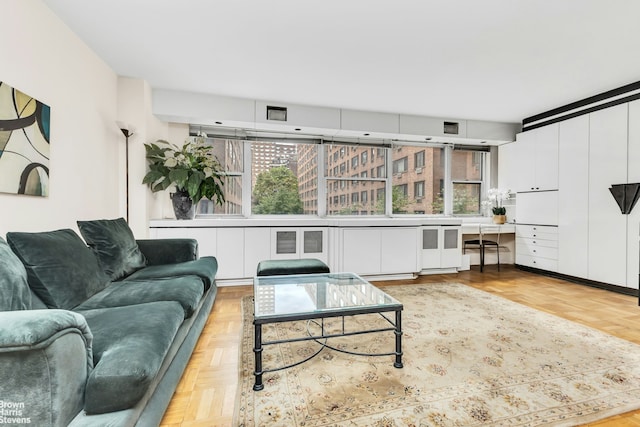 living area featuring built in desk