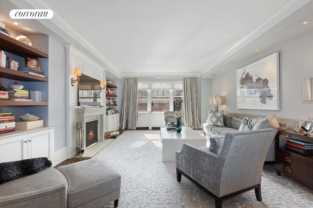 living area with a warm lit fireplace and visible vents