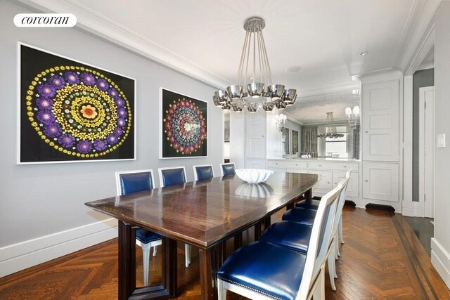 dining space with crown molding, a chandelier, and baseboards