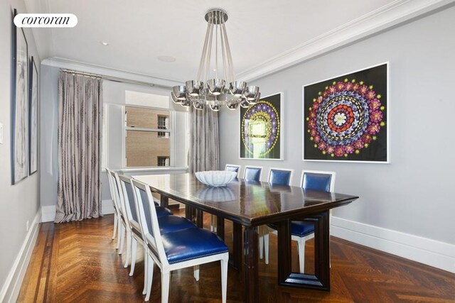 dining area featuring ornamental molding, an inviting chandelier, and baseboards