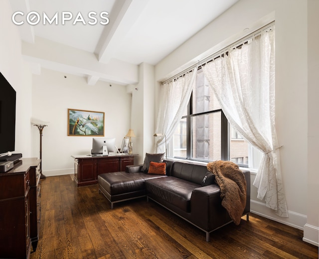 living room with dark wood-style floors, beamed ceiling, and baseboards