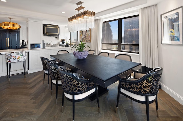 dining room with recessed lighting and baseboards