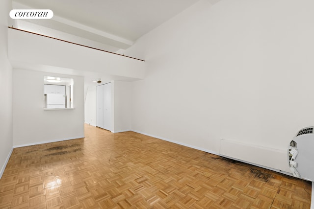 empty room with light parquet floors