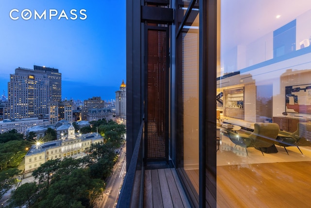 balcony at dusk with a city view