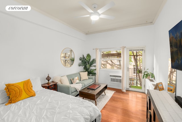 bedroom with access to exterior, visible vents, crown molding, light wood-style floors, and a ceiling fan