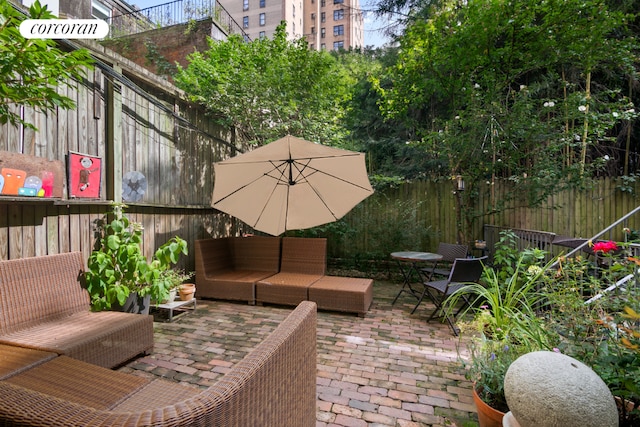 view of patio featuring a fenced backyard and an outdoor hangout area