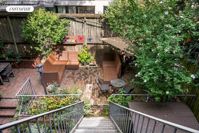 exterior space with fence and outdoor lounge area