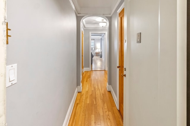424 E 52nd St Unit 3D, New York City, NY 10022 - hall with light wood-style floors, crown molding, and arched walkways