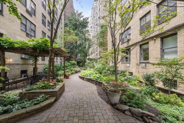 view of property's community featuring a pergola