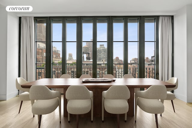 dining area with hardwood / wood-style floors