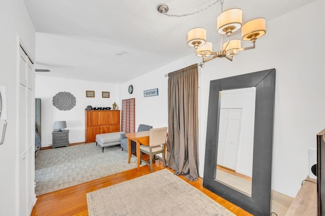 9201 Shore Rd Unit C702/703, New York City, NY 11209 - bedroom with a chandelier and light wood-style flooring