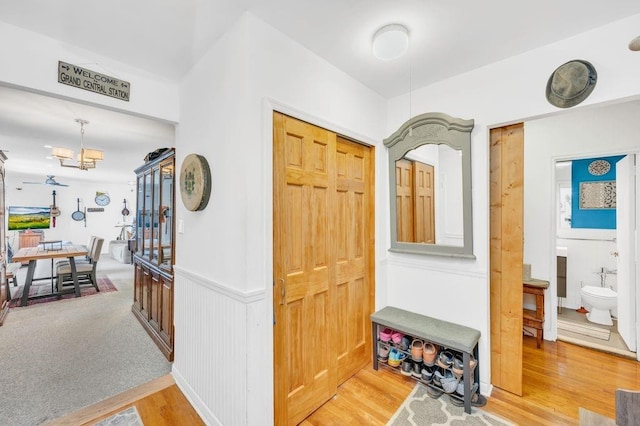 9201 Shore Rd Unit C702/703, New York City, NY 11209 - foyer entrance featuring light wood finished floors and a chandelier
