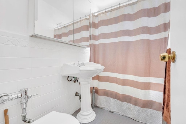 9201 Shore Rd Unit C702/703, New York City, NY 11209 - bathroom featuring toilet, tile walls, and a shower with shower curtain