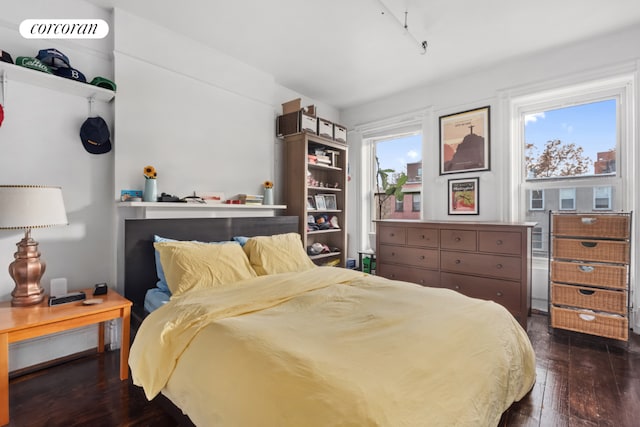 bedroom featuring dark hardwood / wood-style floors