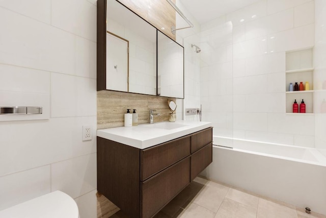 full bathroom with shower / tub combination, tile patterned floors, vanity, backsplash, and toilet