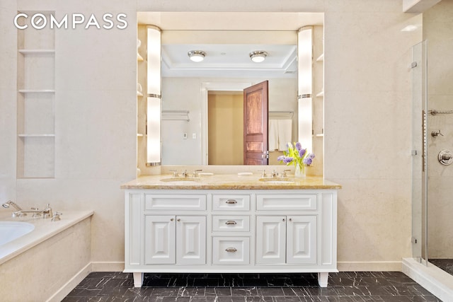 bathroom featuring a stall shower, a garden tub, a sink, and double vanity