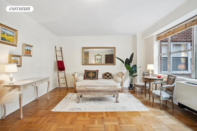 living area with light parquet floors and crown molding