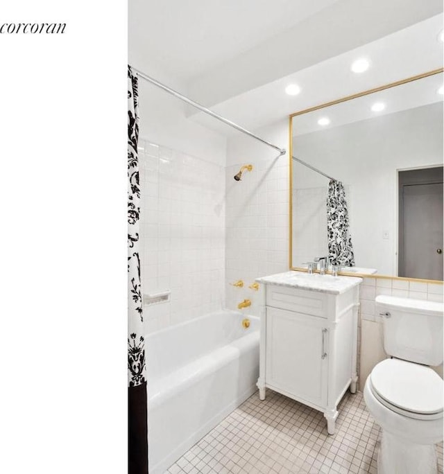 full bathroom with toilet, tile walls, tile patterned floors, shower / bath combination with curtain, and vanity