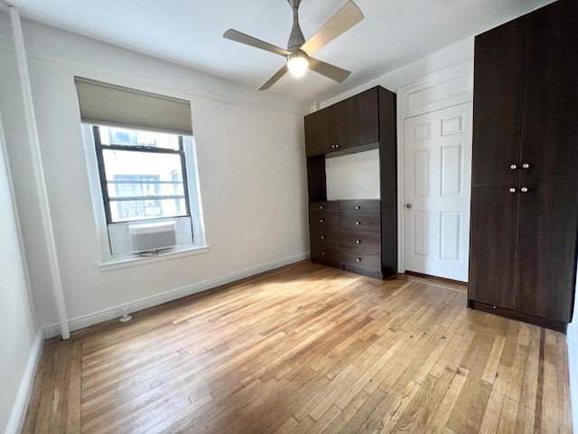 unfurnished bedroom with light wood-type flooring, ceiling fan, and a closet