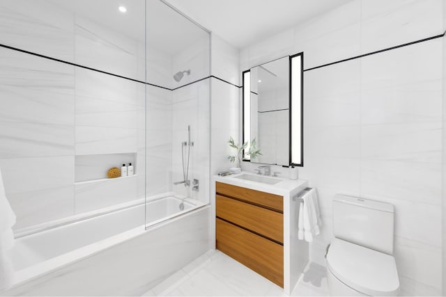 bathroom with toilet, bathtub / shower combination, vanity, and marble finish flooring