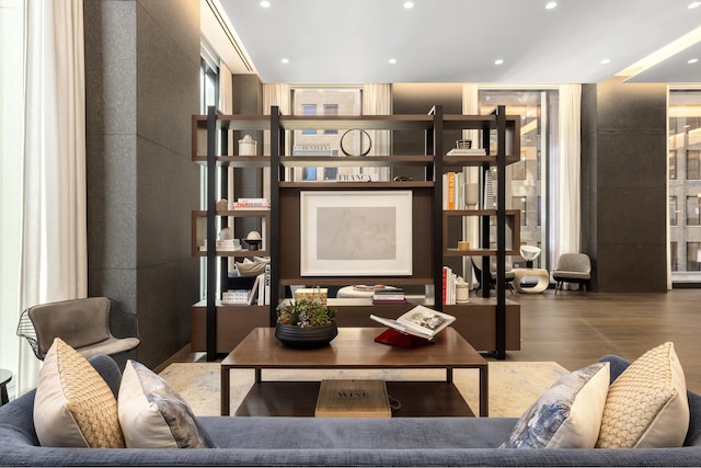living room with wood finished floors, recessed lighting, and floor to ceiling windows