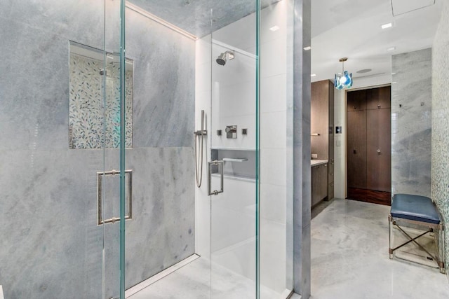 bathroom with an enclosed shower and vanity