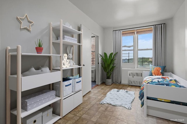 bedroom featuring radiator