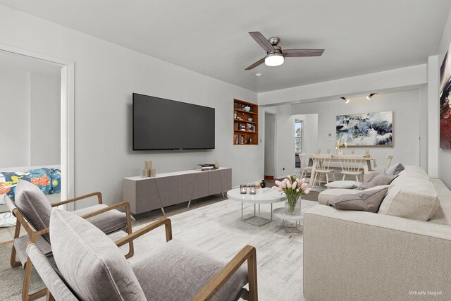 living room with ceiling fan