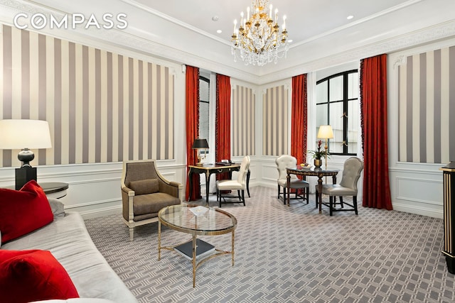 living area with a chandelier, recessed lighting, a decorative wall, carpet flooring, and crown molding