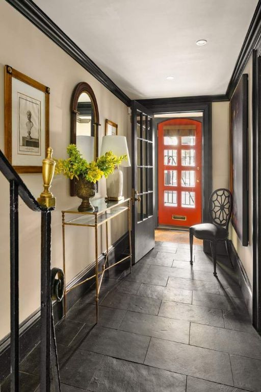 bathroom featuring a tub to relax in, toilet, tile patterned flooring, and tile walls