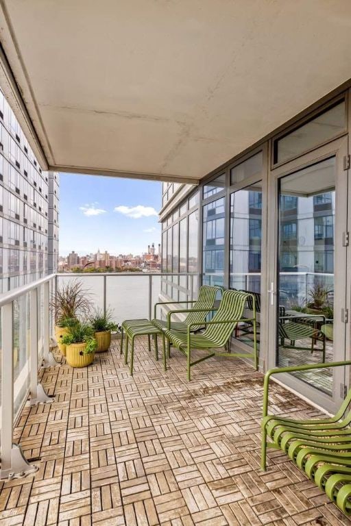 balcony featuring a water view