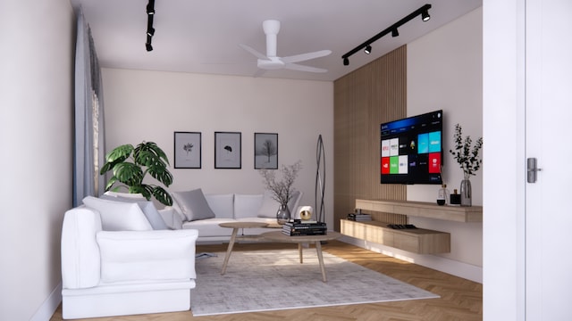 living room featuring light parquet floors, track lighting, and ceiling fan