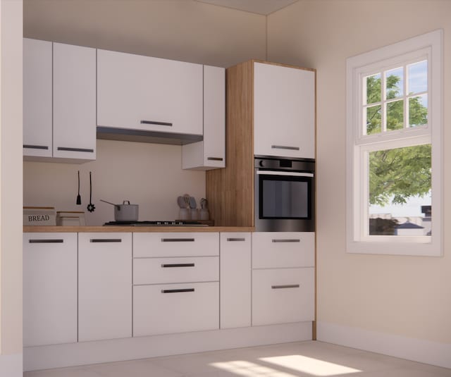 kitchen featuring dark countertops, white cabinets, oven, and under cabinet range hood