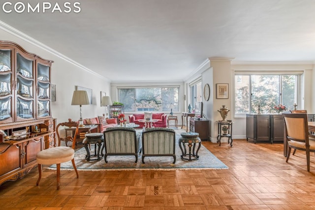 living room with light parquet floors and ornamental molding