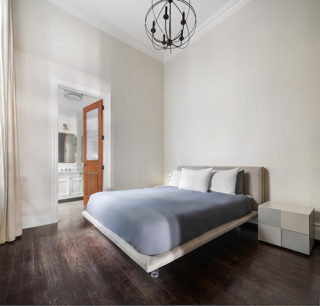 46 Mercer St Unit 4W, New York City, NY 10013 - bedroom featuring a chandelier, crown molding, wood finished floors, baseboards, and ensuite bathroom