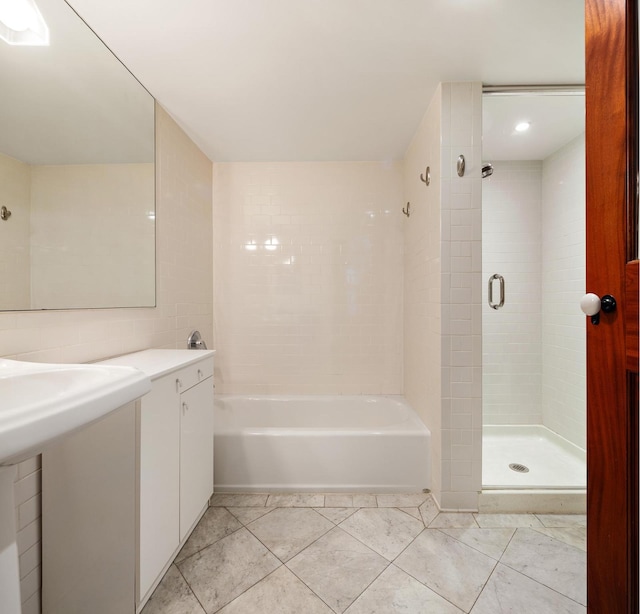 full bath with a shower and a tub to relax in