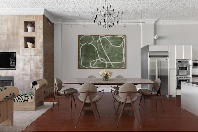 46 Mercer St Unit 4W, New York City, NY 10013 - dining room featuring a chandelier, ornamental molding, and dark wood-style flooring