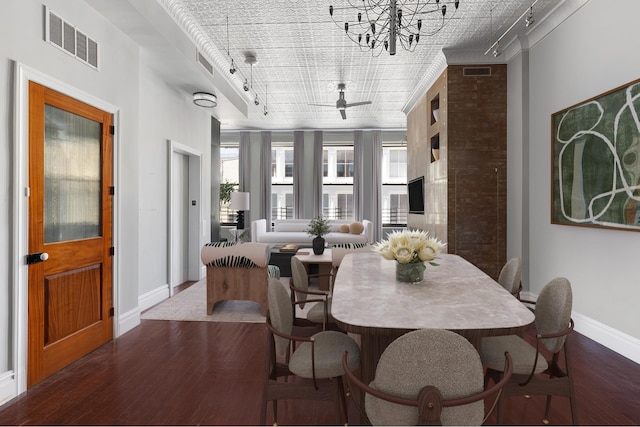 46 Mercer St Unit 4W, New York City, NY 10013 - dining room featuring rail lighting, wood-type flooring, and baseboards