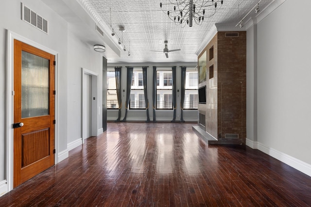 46 Mercer St Unit 4W, New York City, NY 10013 - unfurnished living room featuring track lighting, a chandelier, baseboards, wood-type flooring, and ceiling fan