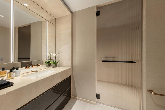 bathroom featuring a stall shower and vanity