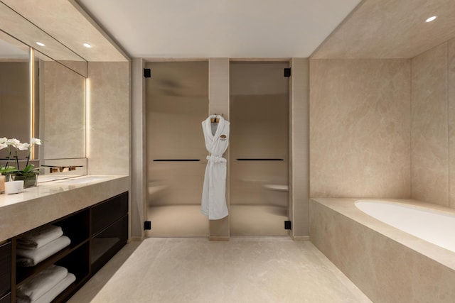 full bath featuring a bath, tile patterned flooring, recessed lighting, and vanity
