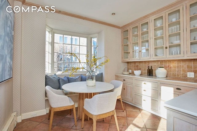 dining area with a baseboard heating unit and breakfast area