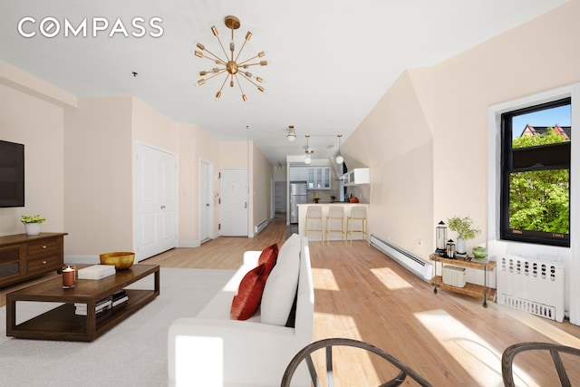 336 Convent Avenue Mltfmly, New York City, NY 10031 - living area with radiator, baseboard heating, light wood-style flooring, and a chandelier